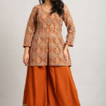 Elegant Peplum Top & Flared Pant Set with Intricate Embroidery